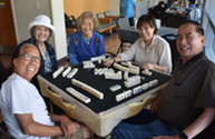 Older Adults playing Mah Jong
