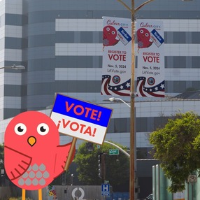 Picture of Birdee vote mascot with vote banner on Culver Blvd