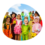 Group of children in Halloween costumes.