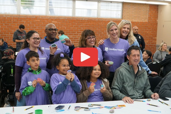 Photo of people participating in the MLK Day of Service - linked to video of 2024 event