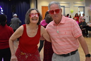 2 older adults posing for a picture