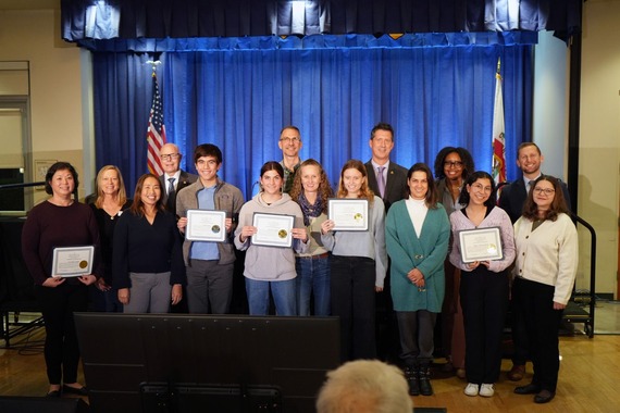 Photo with City Council and families receiving a certificate of recognition on January 27