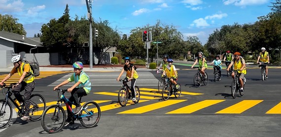 group biking through an intersection