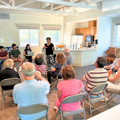 Attendees listen to Mayor Liang Chao leading the Monthly Chat event at Rancho Rinconada