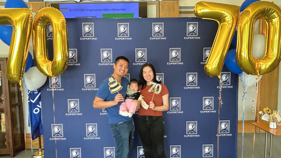 A family poses at City Hall for the City's 70th anniversary celebration on Friday, October 10.