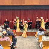 Attendees watch Hawaiian dancers at Na Leo Mokupuni event