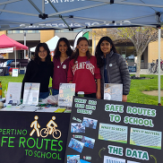 High school students volunteering for Cupertino Safe Routes to School booth