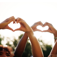 Two sets of hands forming hearts