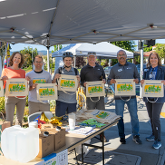 Participants hold Bike to Work Day bag at Energizer Station