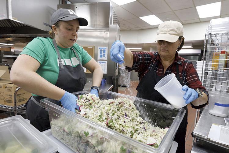 School cafeteria making salad