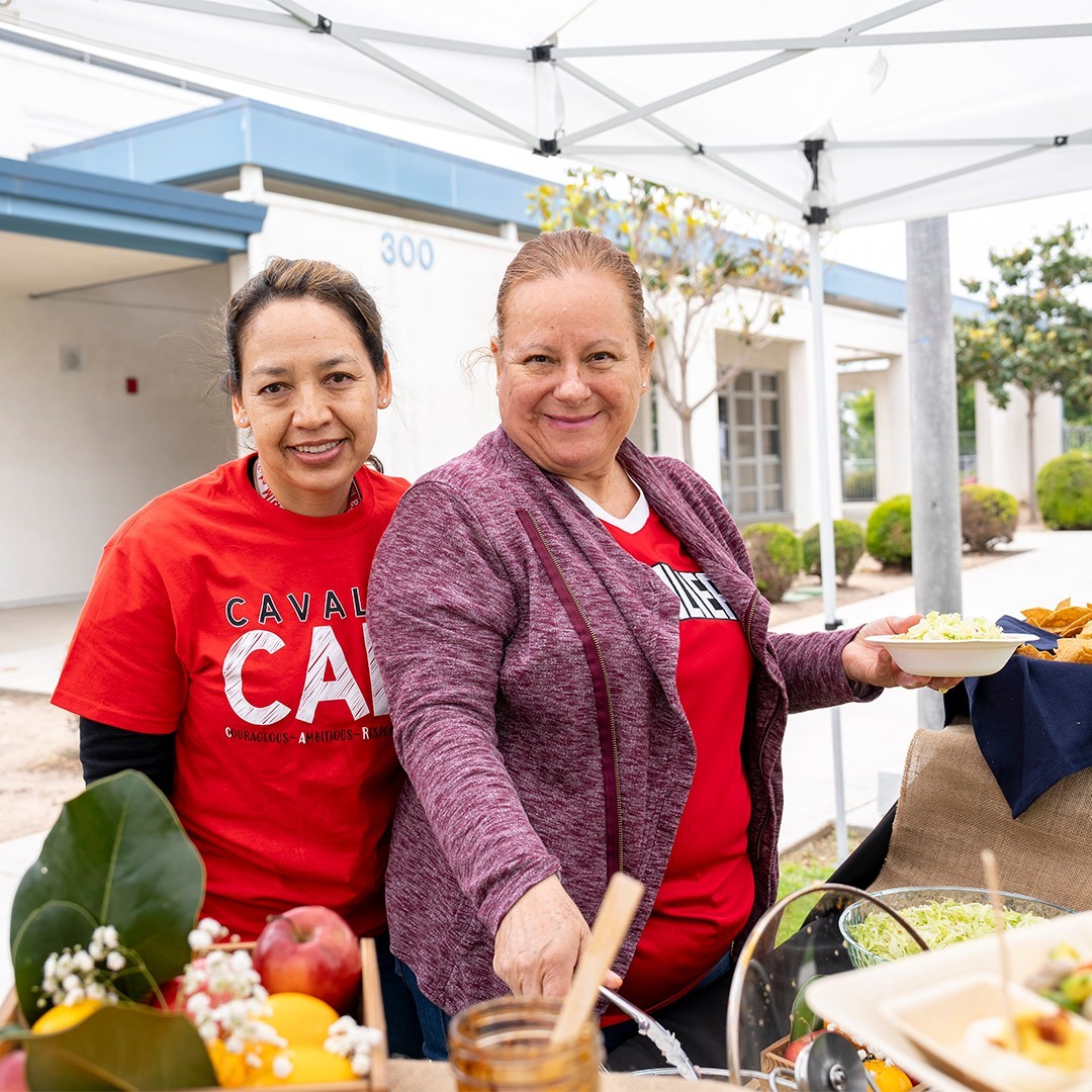 school nutrition services staff serving food