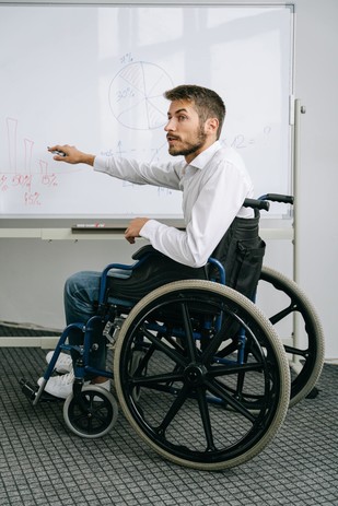 Image of man in wheelchair for Disability Awareness Month