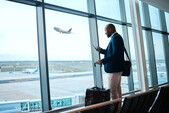 Photo of a man waiting at an airport 