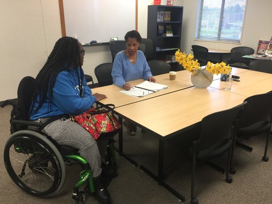 COA career resource center employee working with a client