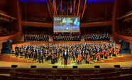 Inner City Youth Orchestra of L.A. musicians standing on concert hall stage
