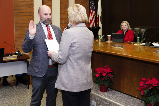 Councilmember Christopher Pimentel being sworn into office by El Segundo City Clerk in council chambers.