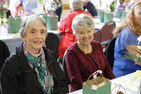 Senior women smiling at a table at Elderfest