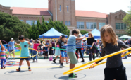 Kids hula hooping in front of El Segundo High School at the Hometown Fair