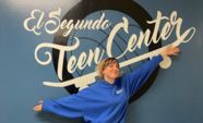 Teen Center staff person in front of El Segundo Teen Center wall