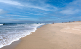 Waves rolling in on the sand of El Segundo Beach