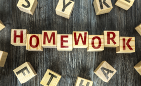 wooden blocks that spell out "homework"