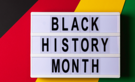 Words "Black History" with colors of the Black Liberation flag