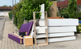 Couch and shelves at the end of a residential driveway