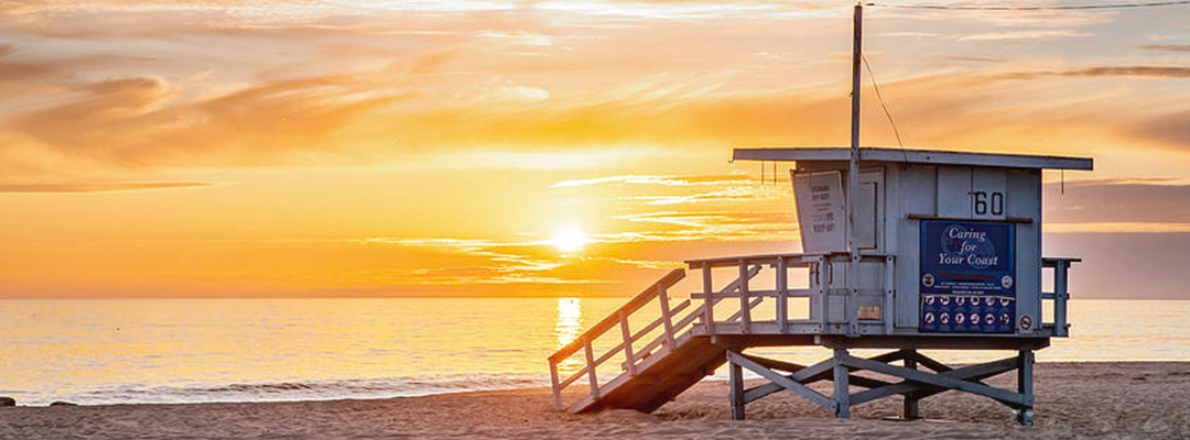 Lifeguard tower at El Segundo Beach at sunset