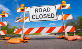 Road closed sign on street