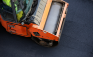 Aerial view of an asphalt roller on a road