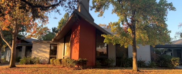 Age Well Center building, tree, and grass