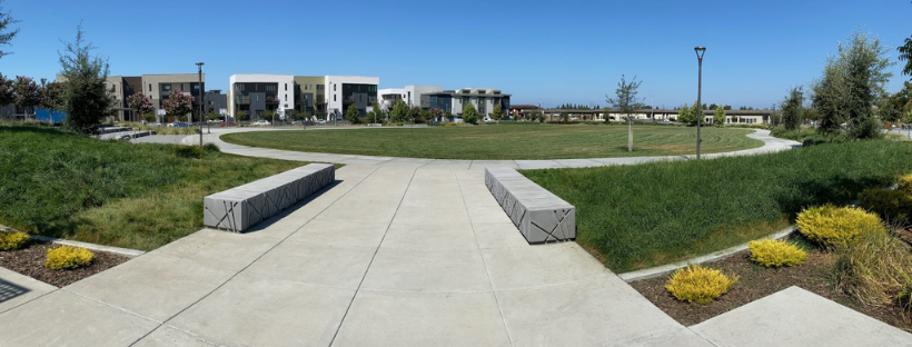 park with benches, plants, shade structures