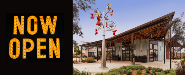 Now Open sign, exterior building, and art scupture