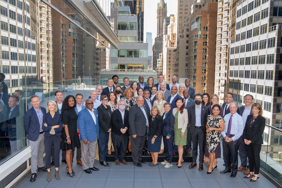 mayors from around the world standing in front of buildings