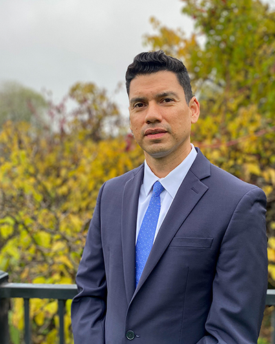 Rafael E. Alvarado, Jr. standing outdoors