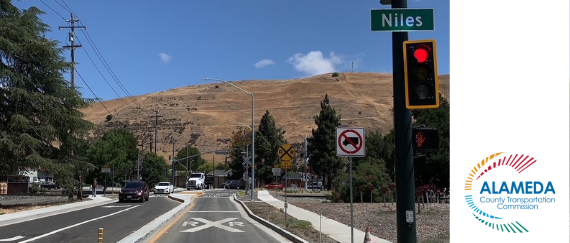 street intersection with railroad crossing and sidewalk