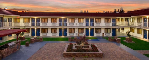 exterior of two-story motel with courtyard area