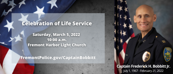 flags and Police Captain Fred Bobbitt in uniform