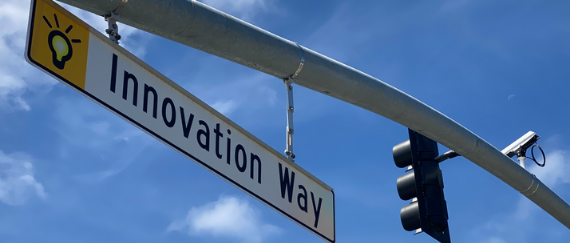 traffic signal and camera on Innovation Way street sign