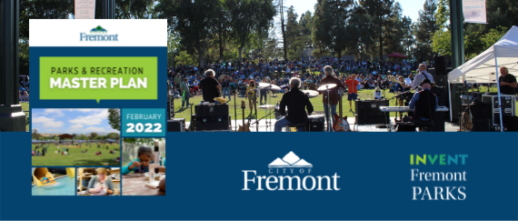 band playing outdoors in front of concert-goers, children on a waterslide, playing on the field, and doing crafts