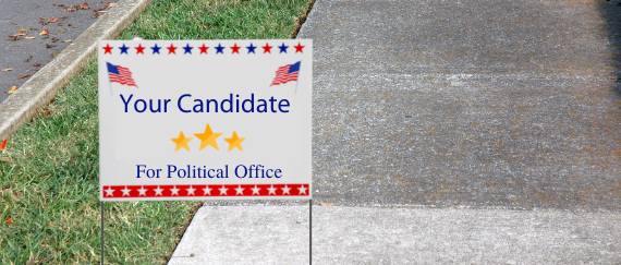 campaign sign on public median and sidewalk