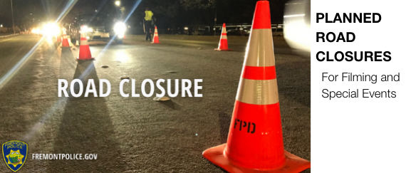 traffic cones, roadway, vehicle with lights on, and Fremont Police Department patch