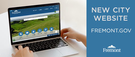 laptop with Fremont hills and new City website text