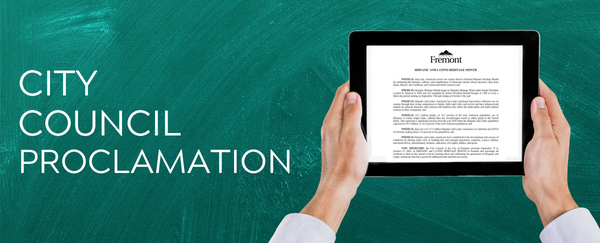 hands holding tablet with City Council Proclamation in text