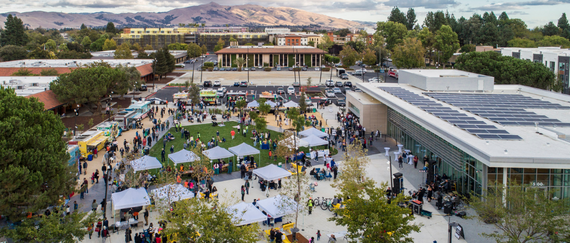 aerial of Downtown Event Center and Plaza with people, booths, and food trucks