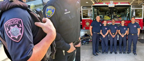 Fremont police officers in uniform with pink patches and Fremont Fire personnel standing in front of fire engine wearing special T-shirts
