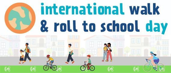 kids and parents walking and biking on street with globe and international walk & roll to school day in text