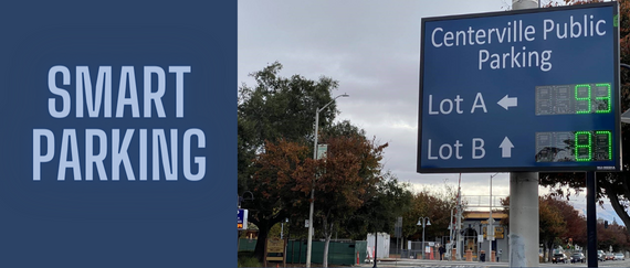 digital sign noting number of parking lot spaces available in Centerville public parking lots. Smart Parking in text.