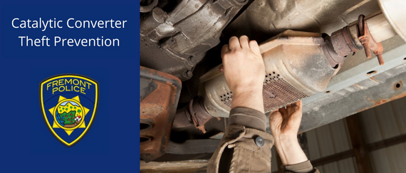 person removing a catalytic converter from underneath a vehicle. Catalytic Converter Theft Prevention in text with Fremont Police patch.