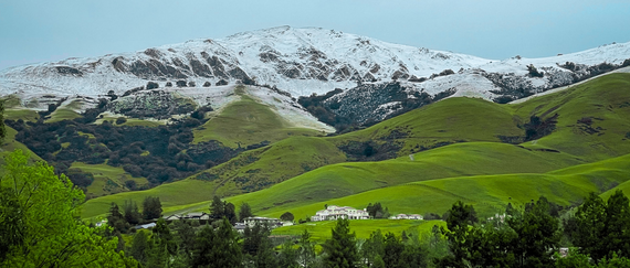 snow capped Fremont green hills from Aqua Caliente Old Mission Park